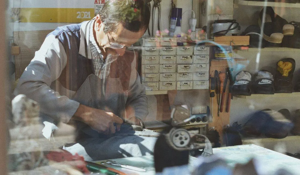Cobbler at work in his workshop