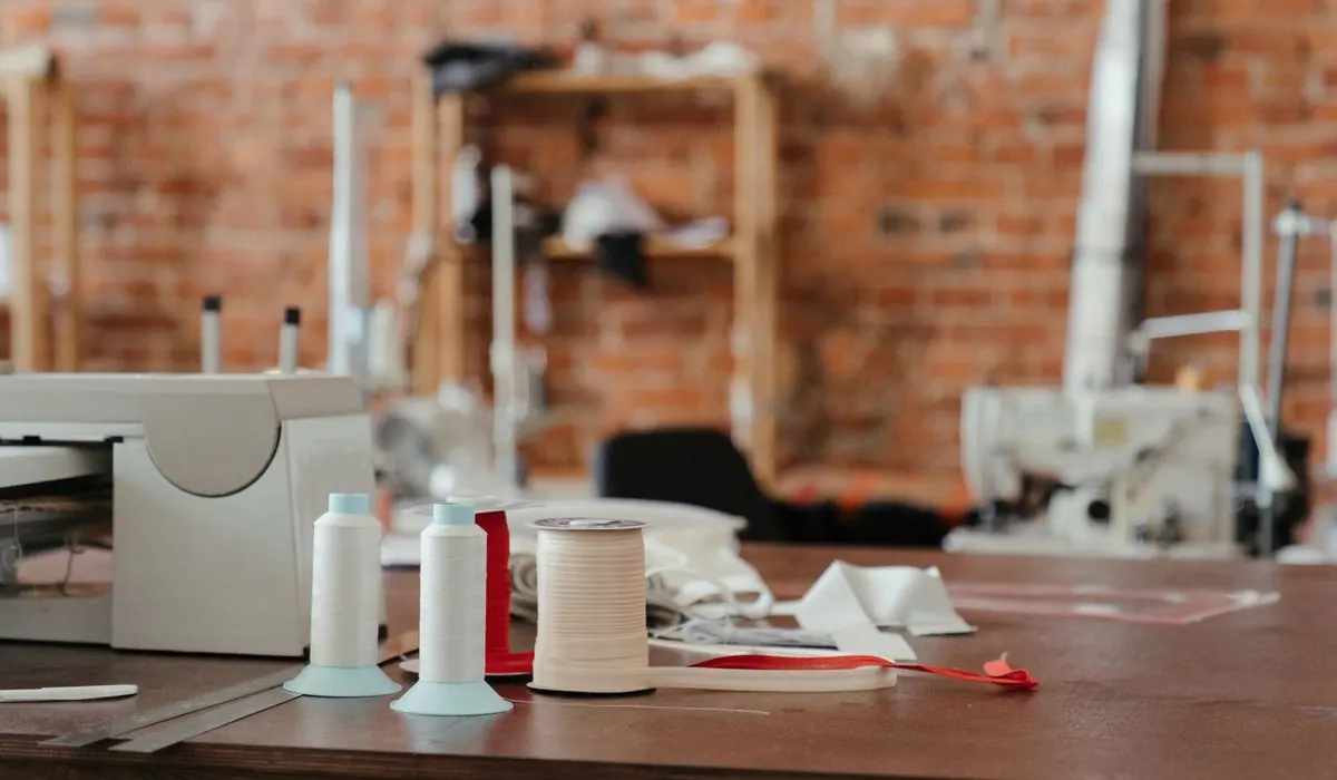 Threads and spools on a garment workshop table