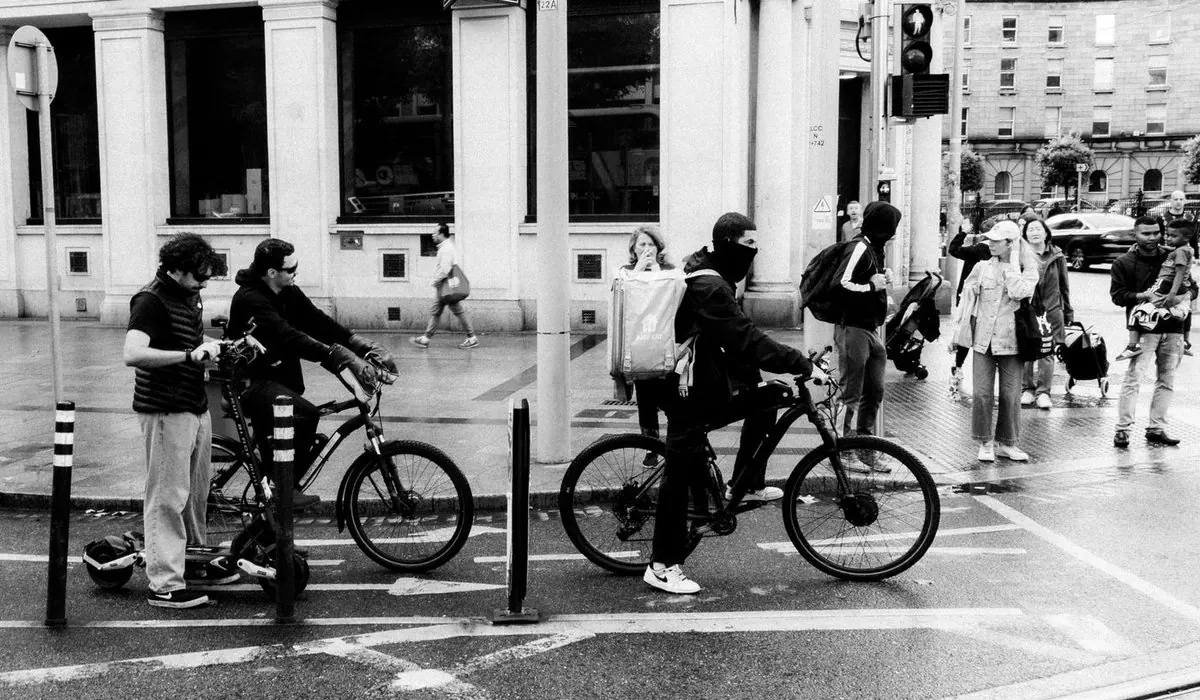 Cyclist in a rain jacket on a wet street